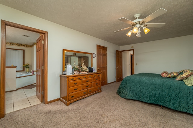 carpeted bedroom with a textured ceiling and ceiling fan