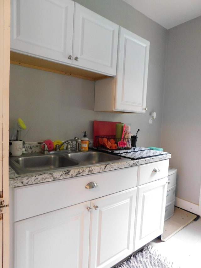 kitchen with white cabinets and sink