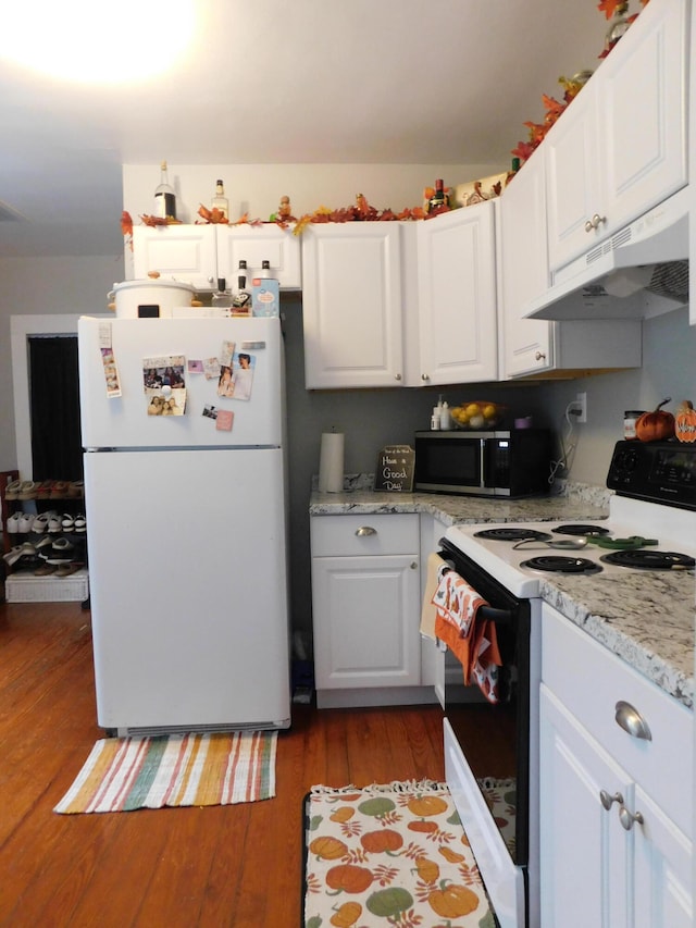 kitchen with light hardwood / wood-style flooring, white cabinets, and white appliances