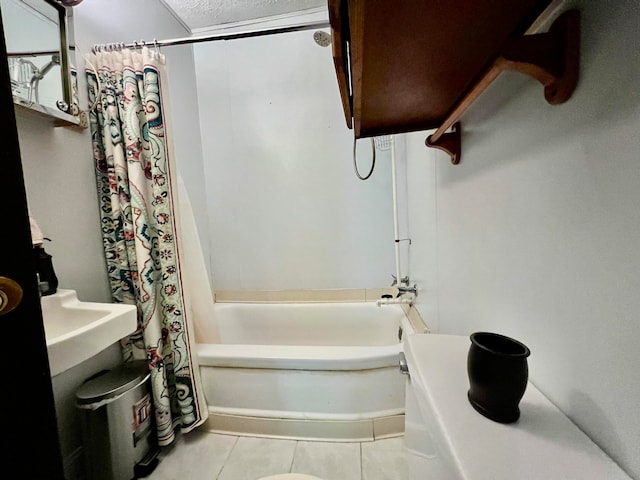 bathroom with tile patterned flooring and shower / bath combo