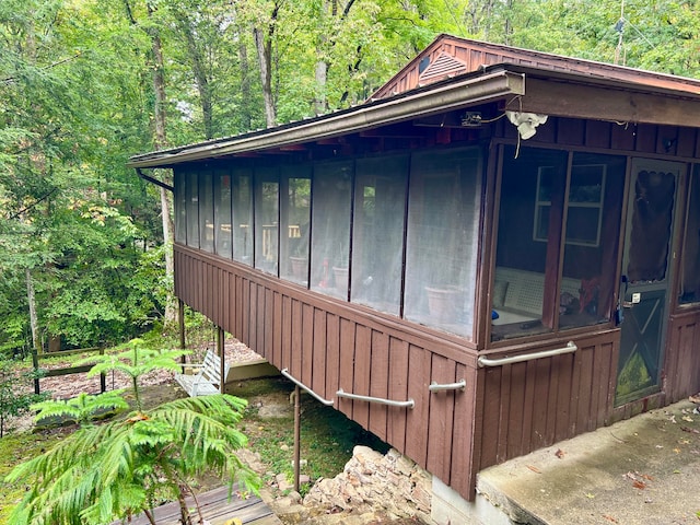 view of side of home with a sunroom