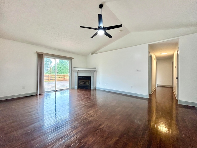 unfurnished living room featuring a textured ceiling, lofted ceiling, ceiling fan, and dark hardwood / wood-style flooring