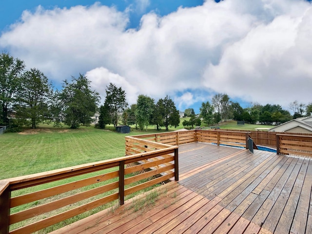 wooden deck with a lawn