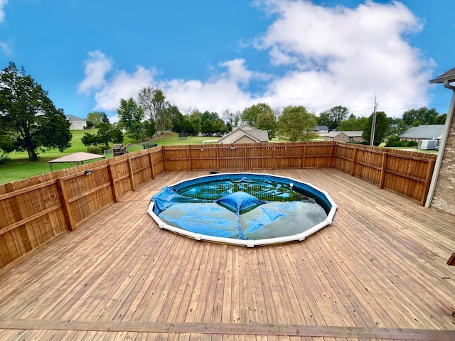 view of swimming pool with a deck and a jacuzzi