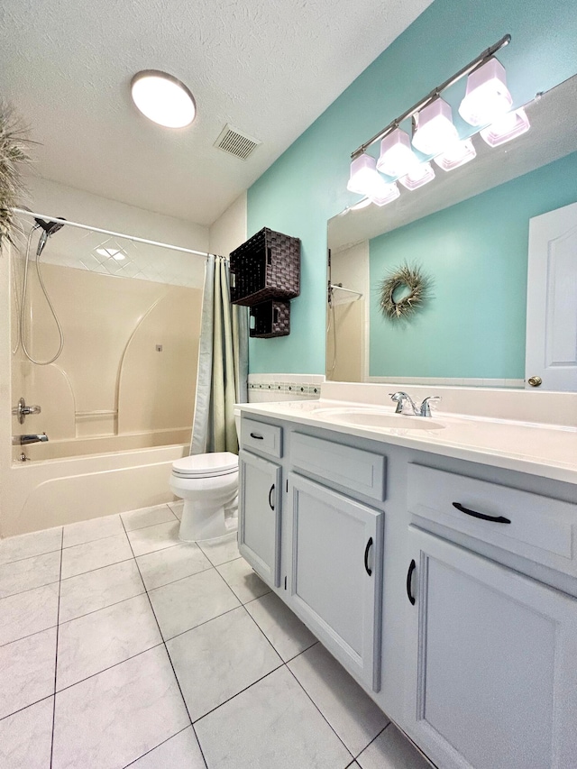 full bathroom featuring shower / bathtub combination with curtain, vanity, a textured ceiling, toilet, and tile patterned floors