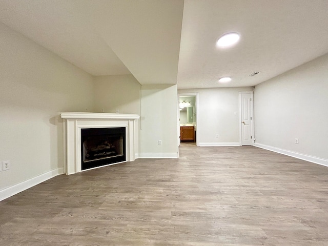 unfurnished living room featuring hardwood / wood-style floors