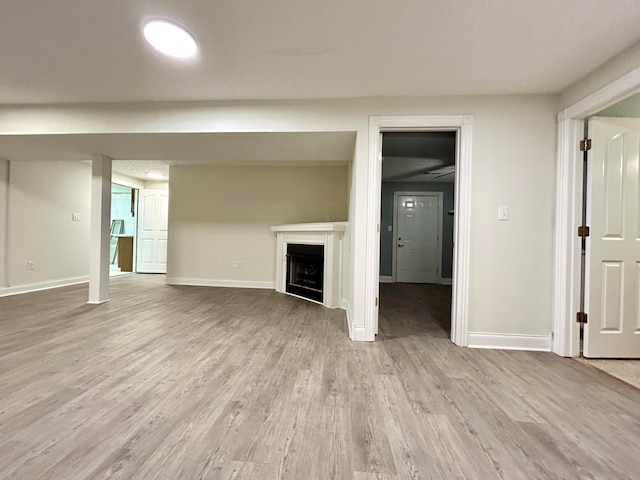 unfurnished living room featuring light wood-type flooring