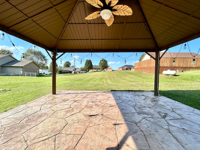 view of patio / terrace with a gazebo and ceiling fan