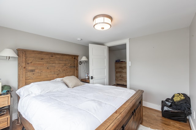 bedroom with hardwood / wood-style floors