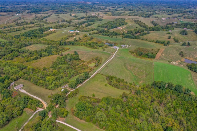 birds eye view of property with a rural view