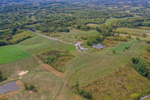 drone / aerial view featuring a rural view and a water view