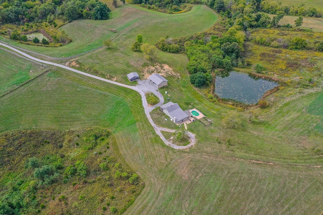 bird's eye view featuring a water view and a rural view