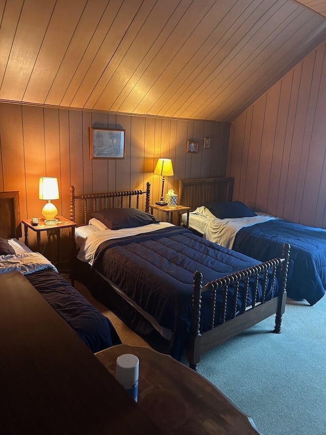 bedroom with wood ceiling, vaulted ceiling, wood walls, and carpet flooring