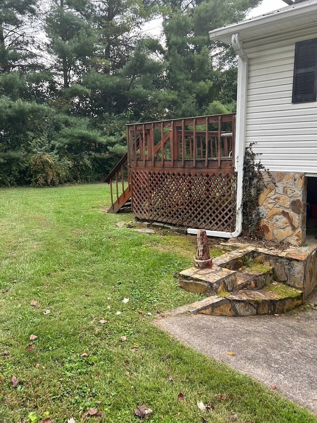 view of yard with a wooden deck