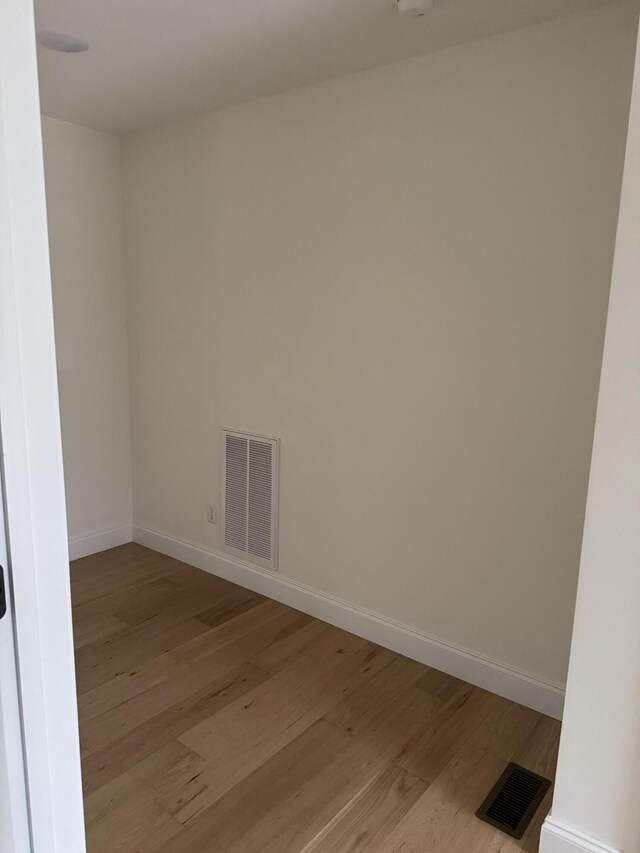 spare room with light hardwood / wood-style floors