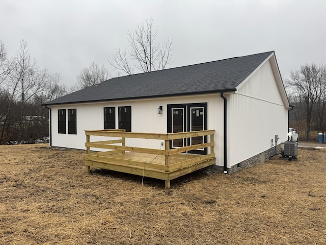 back of house with a deck and central AC unit