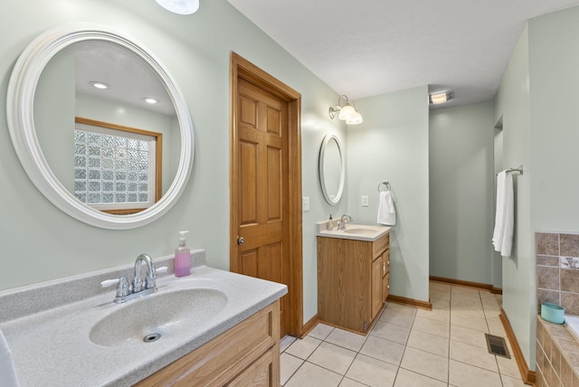 bathroom with tile patterned floors and vanity