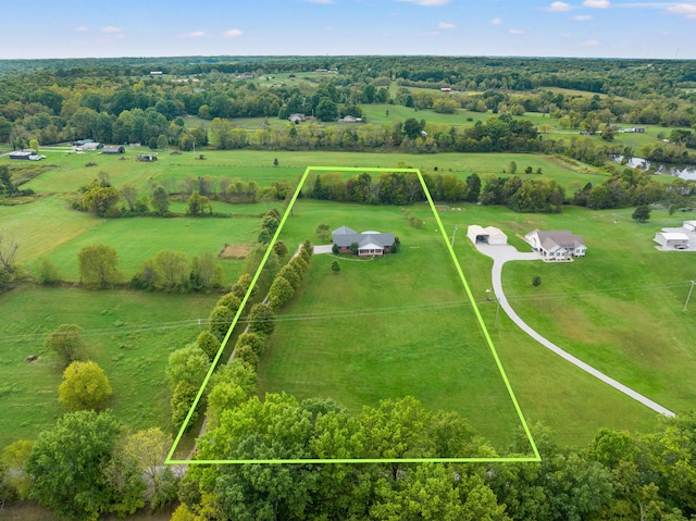 birds eye view of property with a rural view