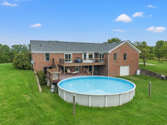 view of swimming pool featuring a wooden deck and a lawn