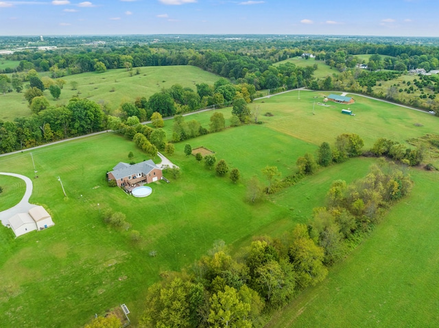 birds eye view of property with a rural view