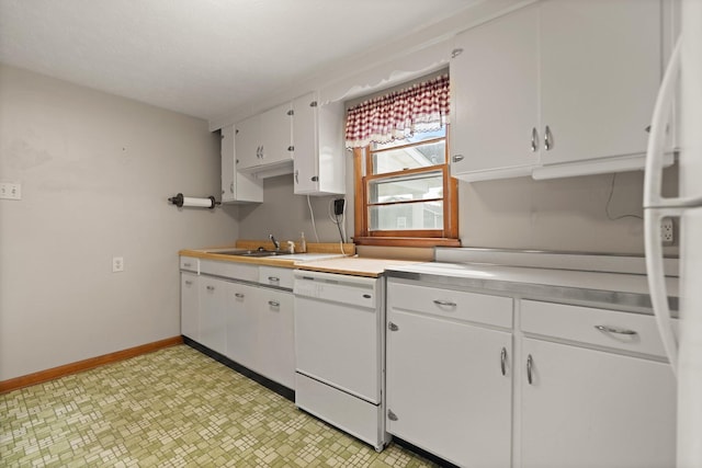 kitchen featuring white appliances and white cabinetry