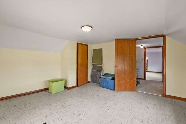 bonus room featuring vaulted ceiling