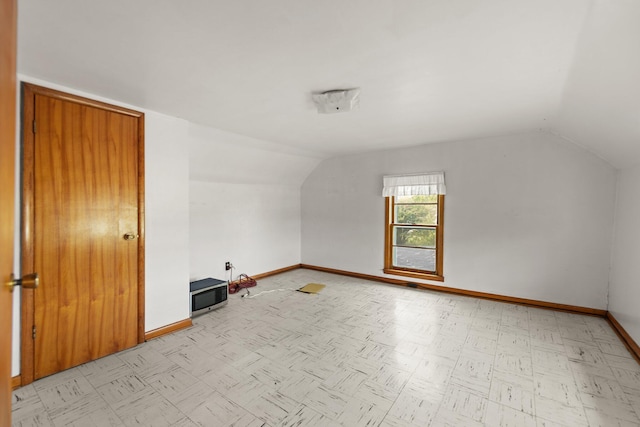 bonus room featuring lofted ceiling