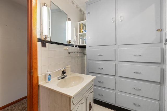 bathroom featuring vanity and decorative backsplash