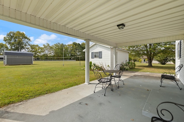 view of patio with a storage shed