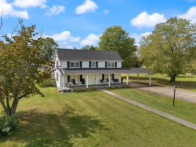 view of front facade featuring a front yard, a porch, and a carport