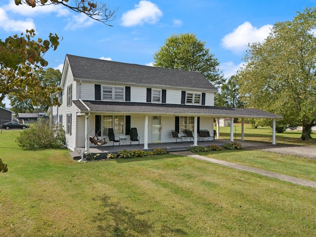 farmhouse featuring a front yard and covered porch