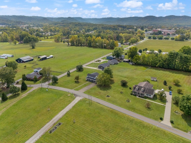 birds eye view of property featuring a mountain view and a rural view