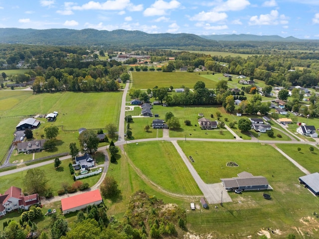 drone / aerial view featuring a rural view and a mountain view