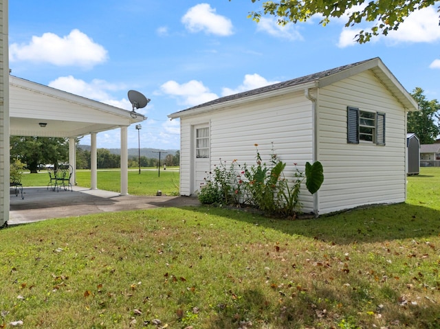 exterior space with a lawn and a patio area