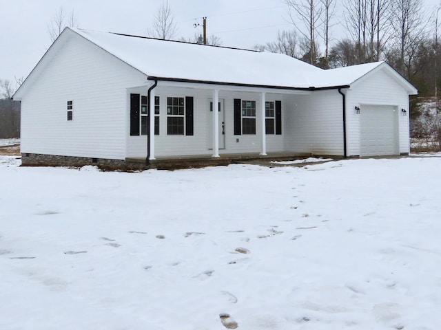 single story home with covered porch and a garage