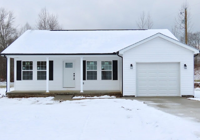 single story home featuring covered porch and a garage