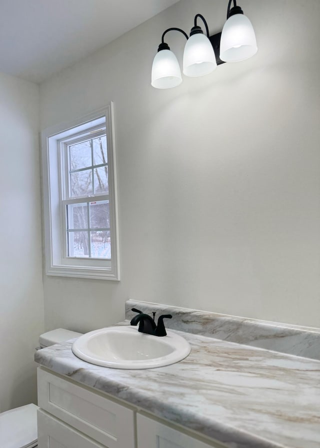 bathroom with vanity and toilet