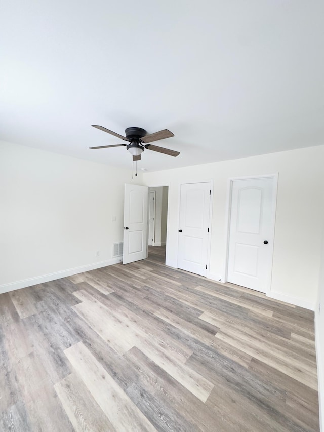 interior space featuring light hardwood / wood-style floors and ceiling fan