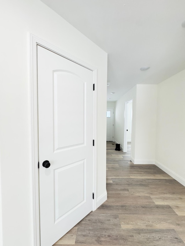 hall with light hardwood / wood-style flooring