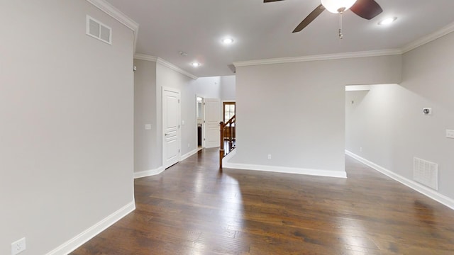 unfurnished room featuring ceiling fan, crown molding, and dark hardwood / wood-style flooring