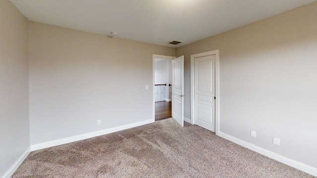 unfurnished room with carpet flooring