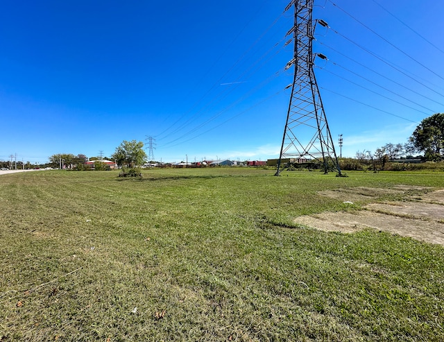 view of yard with a rural view