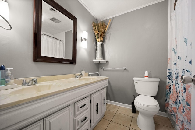 bathroom featuring vanity, tile patterned flooring, toilet, and crown molding