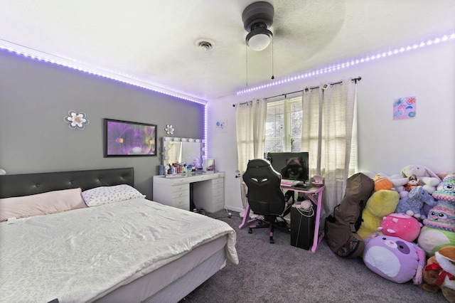 bedroom with ceiling fan and carpet flooring