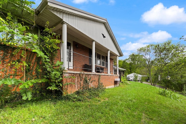 view of home's exterior with a yard