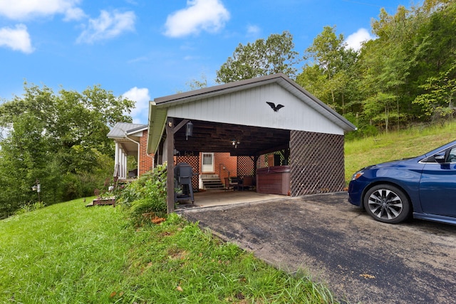 exterior space featuring a yard and a carport