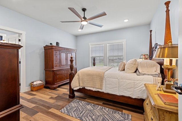 bedroom featuring wood-type flooring and ceiling fan