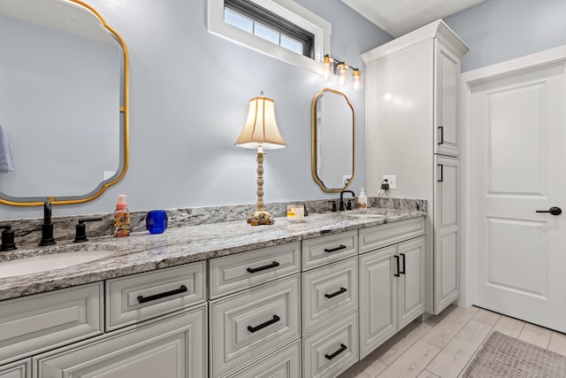 bathroom featuring hardwood / wood-style floors and vanity