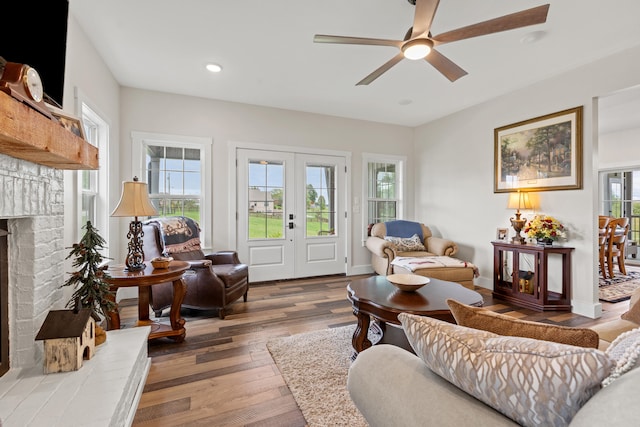 living room with ceiling fan, hardwood / wood-style floors, a healthy amount of sunlight, and french doors