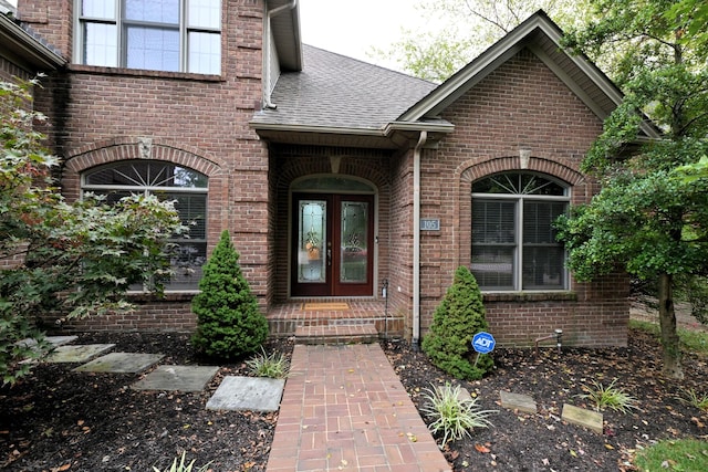 view of front of home with french doors and a front lawn